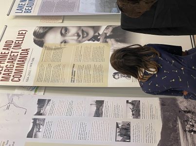 girl looking at poster